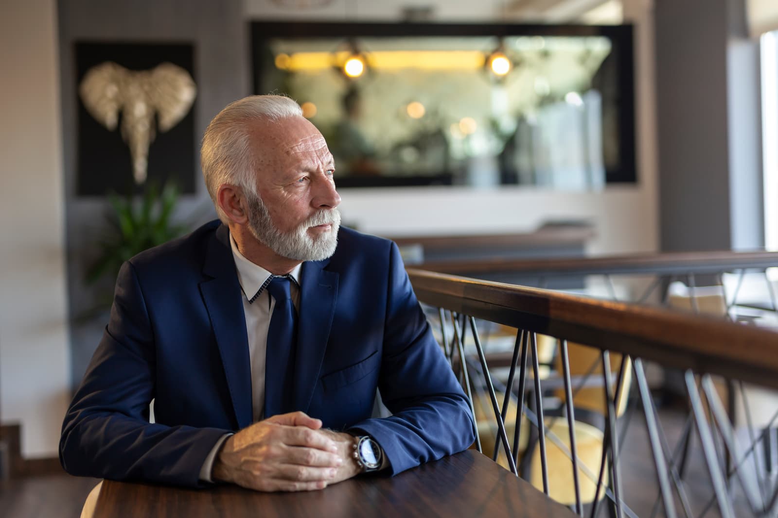 Pensive senior businessman in restaurant
