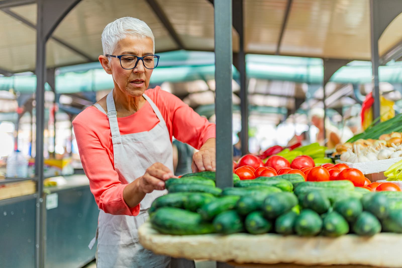 Senior Woman Selling Fresh Local Vegetable From Farm at Market