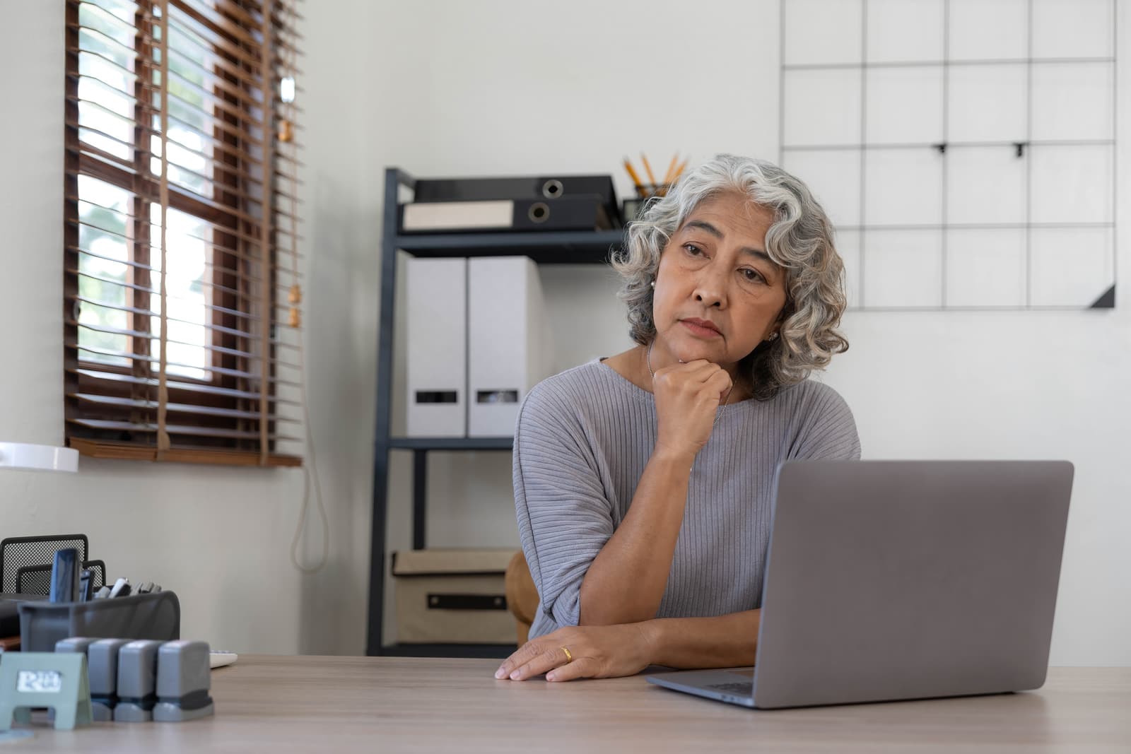 The elderly Asian woman sat in the home