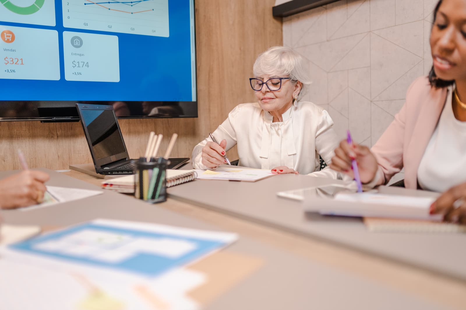 White-haired senior businesswoman in a budget meeting