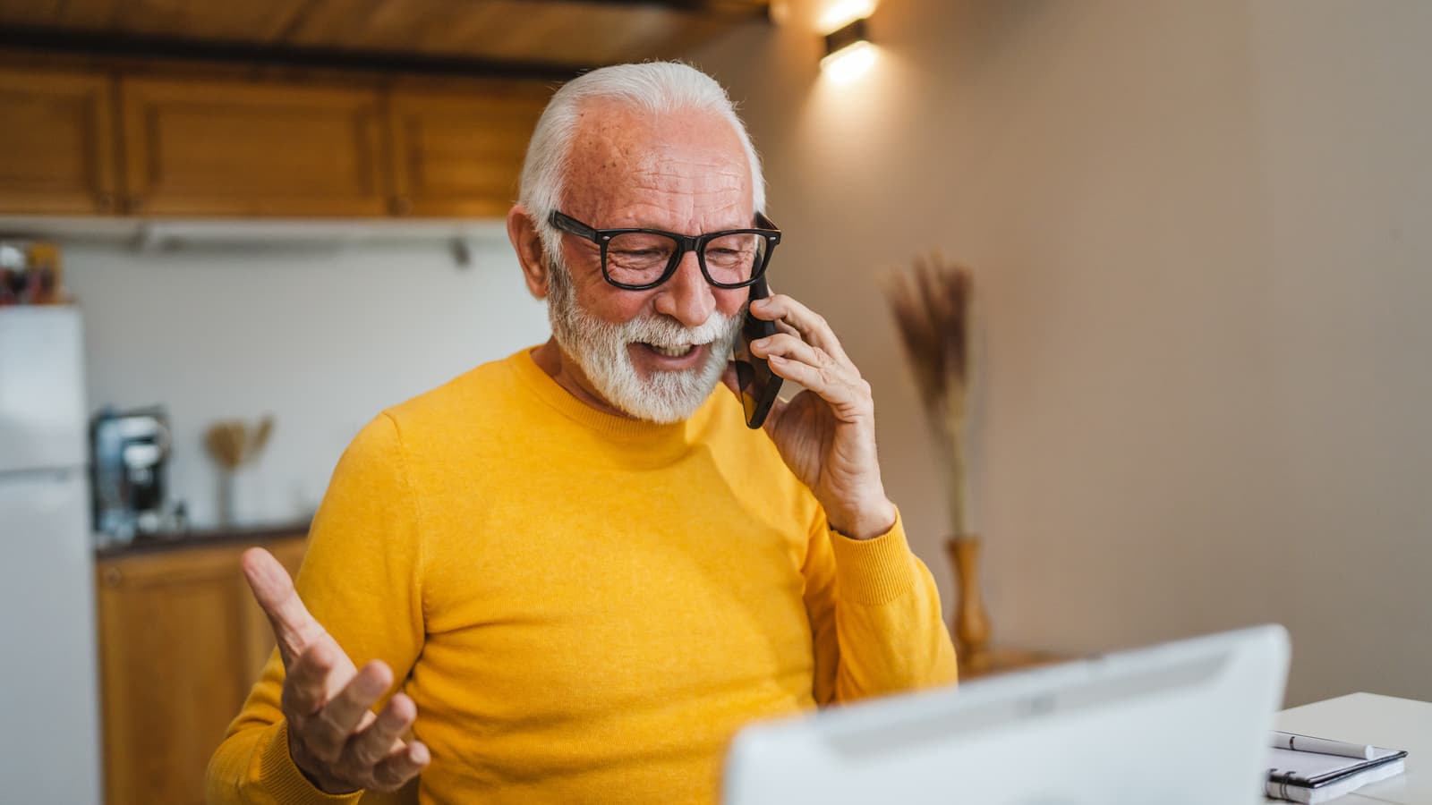 One senior man sit work in tiny house use smart phone make a call